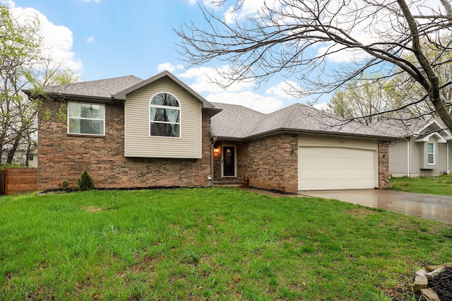 3239 W Erie St, Springfield, MO 65807 - tri-level home with brick siding, concrete driveway, an attached garage, and roof with shingles