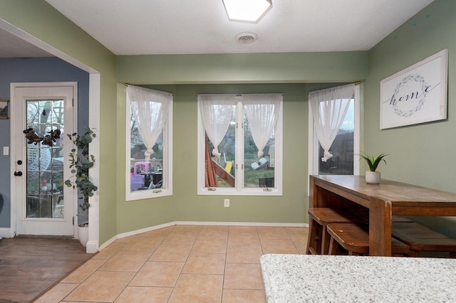 3239 W Erie St, Springfield, MO 65807 - dining space with healthy amount of natural light and light tile patterned floors
