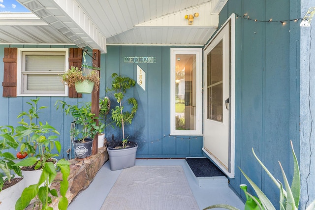 189 Pierce Pl, Forsyth, MO 65653 - doorway to property with board and batten siding and covered porch