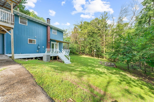 189 Pierce Pl, Forsyth, MO 65653 - view of green lawn featuring a wooden deck and stairway