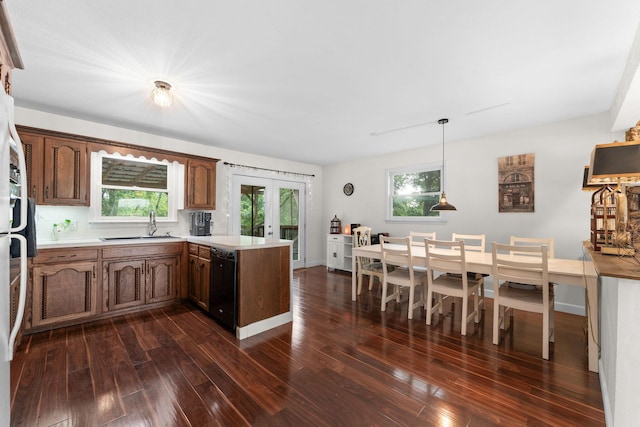 189 Pierce Pl, Forsyth, MO 65653 - kitchen with a peninsula, black dishwasher, dark wood finished floors, light countertops, and french doors