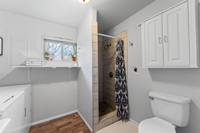 189 Pierce Pl, Forsyth, MO 65653 - bathroom with independent washer and dryer, a tile shower, wood finished floors, and vanity