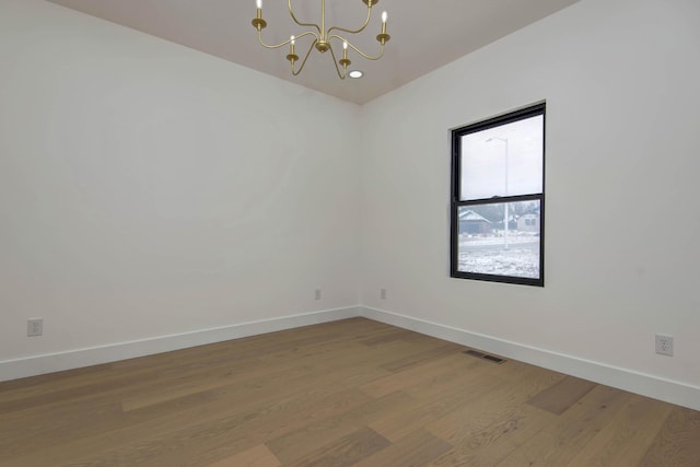 2112 N Sun Valley Dr, Springfield, MO 65802 - spare room featuring a chandelier and light wood-style flooring