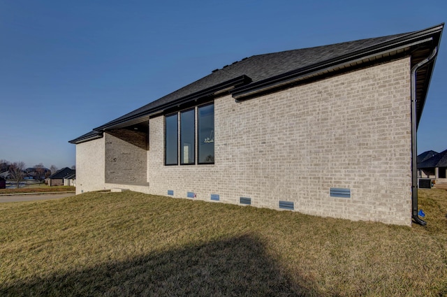 2112 N Sun Valley Dr, Springfield, MO 65802 - view of property exterior with crawl space, brick siding, a yard, and a shingled roof