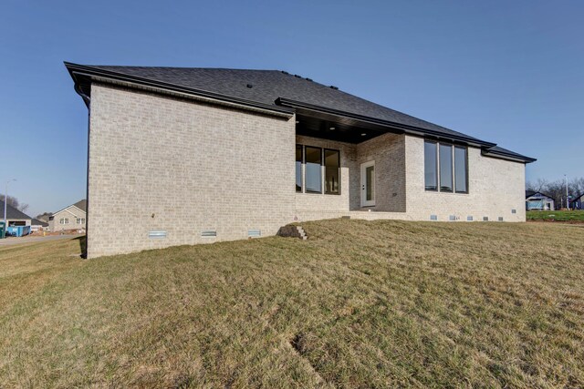 2112 N Sun Valley Dr, Springfield, MO 65802 - back of property featuring brick siding, crawl space, and a yard