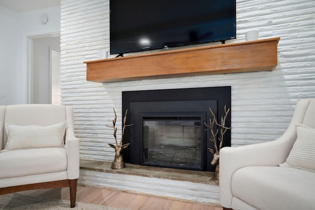 1923 S Cedarbrook Ave, Springfield, MO 65804 - detailed view of wood finished floors and a glass covered fireplace