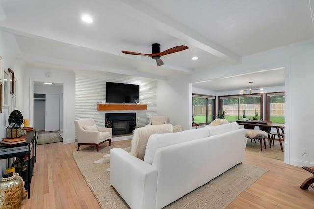 1923 S Cedarbrook Ave, Springfield, MO 65804 - living area with a brick fireplace, beam ceiling, light wood-style floors, a ceiling fan, and recessed lighting