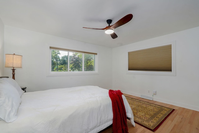 1923 S Cedarbrook Ave, Springfield, MO 65804 - bedroom with wood finished floors and a ceiling fan