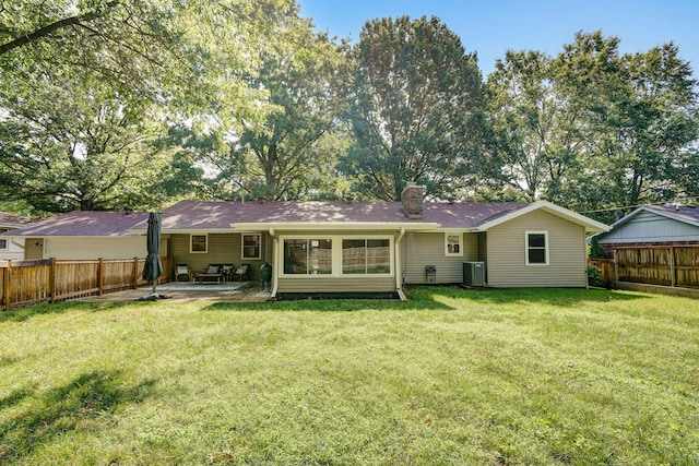 1923 S Cedarbrook Ave, Springfield, MO 65804 - rear view of house featuring a patio, a chimney, and a fenced backyard