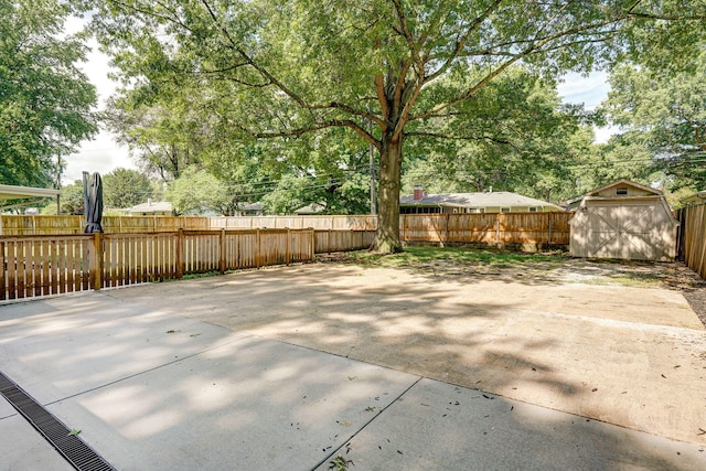 1923 S Cedarbrook Ave, Springfield, MO 65804 - fenced backyard with a storage shed and a patio