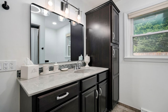1923 S Cedarbrook Ave, Springfield, MO 65804 - bathroom featuring vanity and baseboards