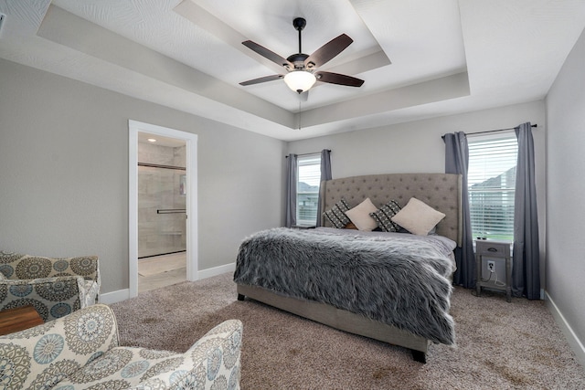 917 W Charlotte St, Republic, MO 65738 - bedroom with carpet flooring, a tray ceiling, connected bathroom, and ceiling fan
