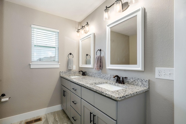 917 W Charlotte St, Republic, MO 65738 - full bathroom with double vanity and marble finish flooring
