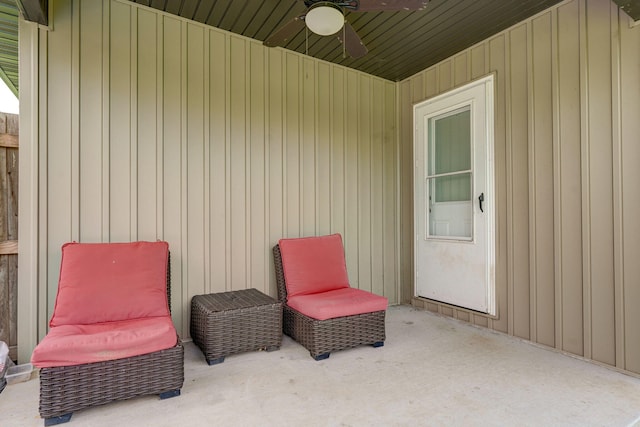 917 W Charlotte St, Republic, MO 65738 - living area with carpet floors, a ceiling fan, and wood walls
