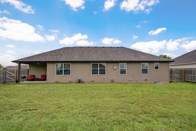 917 W Charlotte St, Republic, MO 65738 - rear view of house featuring crawl space, a patio area, a fenced backyard, and a shingled roof