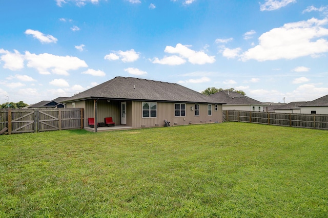 917 W Charlotte St, Republic, MO 65738 - back of property with a fenced backyard, a patio, a gate, and a shingled roof