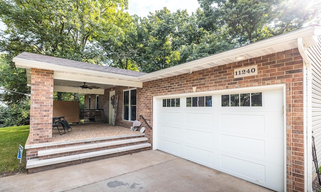 11240 State Hwy E, Rolla, MO 65401 - garage featuring a porch, concrete driveway, and a ceiling fan