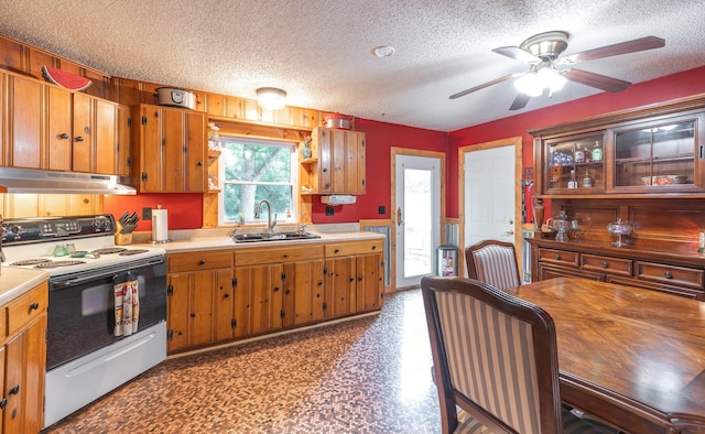 11240 State Hwy E, Rolla, MO 65401 - kitchen featuring under cabinet range hood, range with electric stovetop, a textured ceiling, ceiling fan, and brown cabinetry