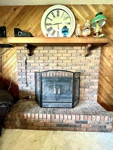 817 Fillmore St, Mount Vernon, MO 65712 - detailed view of a fireplace and wood walls