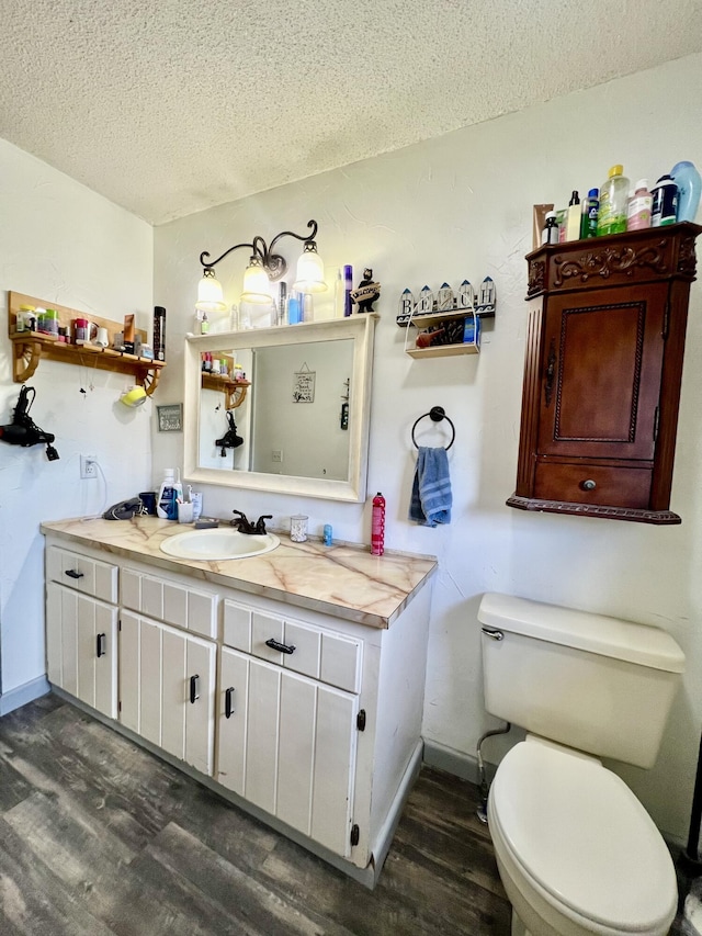 817 Fillmore St, Mount Vernon, MO 65712 - bathroom featuring a textured ceiling, wood finished floors, and vanity