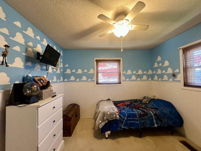 817 Fillmore St, Mount Vernon, MO 65712 - carpeted bedroom with a textured ceiling, multiple windows, and ceiling fan