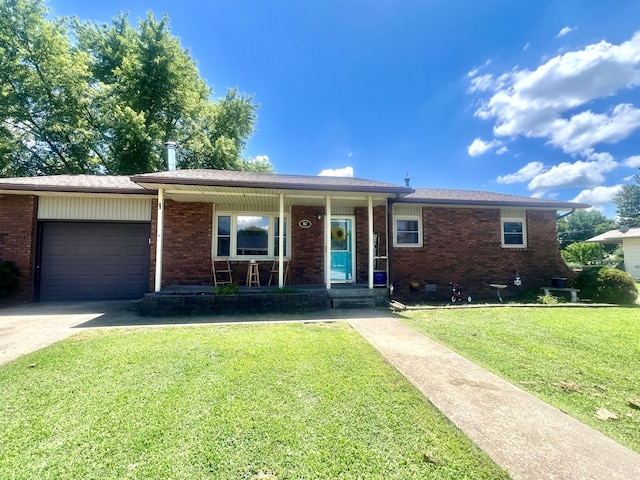 817 Fillmore St, Mount Vernon, MO 65712 - ranch-style home with a garage, brick siding, a front yard, and driveway