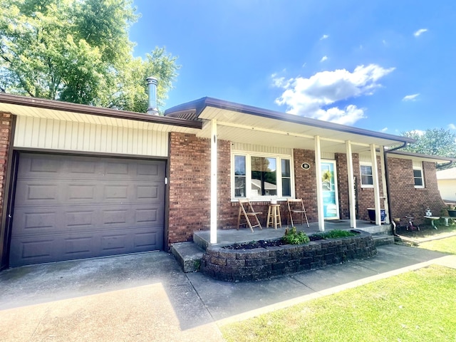 817 Fillmore St, Mount Vernon, MO 65712 - single story home featuring covered porch, an attached garage, concrete driveway, and brick siding