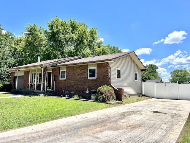 817 Fillmore St, Mount Vernon, MO 65712 - ranch-style house featuring driveway, a gate, brick siding, and a porch