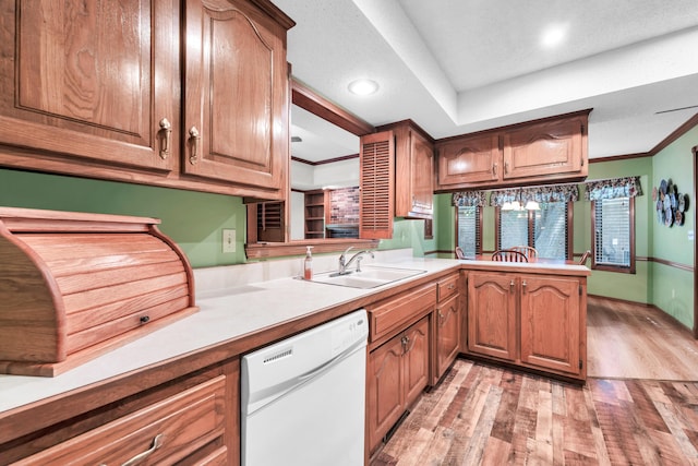 1011 W Tracy St, Springfield, MO 65807 - kitchen with dishwasher, light wood-type flooring, a peninsula, light countertops, and recessed lighting