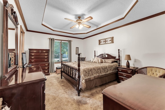 1011 W Tracy St, Springfield, MO 65807 - bedroom featuring a raised ceiling, light colored carpet, ornamental molding, a textured ceiling, and a ceiling fan