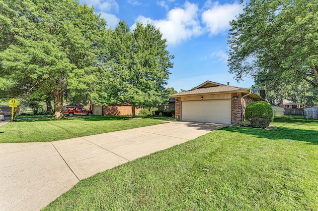 1011 W Tracy St, Springfield, MO 65807 - view of front of home with brick siding, driveway, and an attached garage