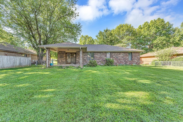 1011 W Tracy St, Springfield, MO 65807 - back of house with brick siding, roof with shingles, and covered porch