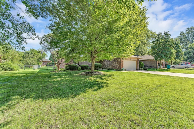 1011 W Tracy St, Springfield, MO 65807 - view of front of house featuring concrete driveway, a garage, and brick siding
