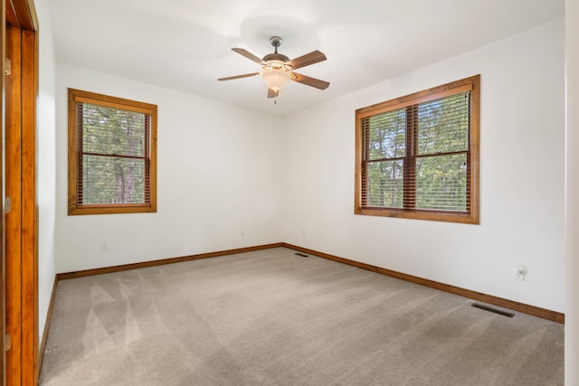 744 Seven Pines Dr, Saddlebrooke, MO 65630 - carpeted spare room with baseboards and a ceiling fan