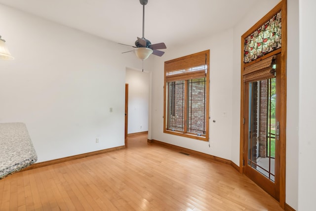 744 Seven Pines Dr, Saddlebrooke, MO 65630 - empty room featuring a ceiling fan and light wood finished floors