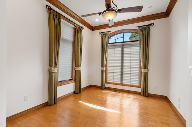 744 Seven Pines Dr, Saddlebrooke, MO 65630 - spare room featuring crown molding, a ceiling fan, and light wood-type flooring