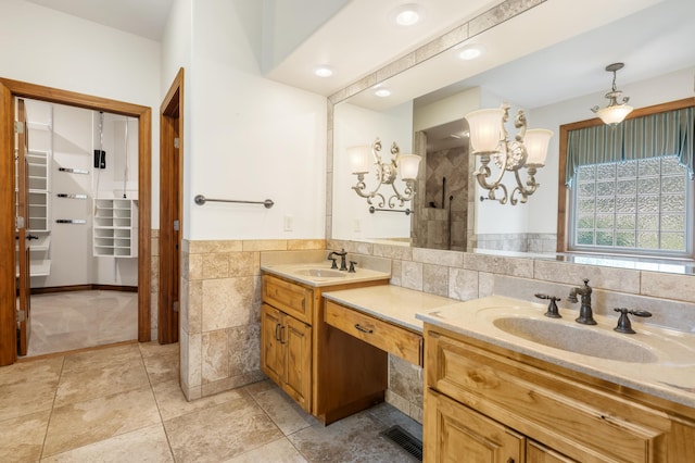 744 Seven Pines Dr, Saddlebrooke, MO 65630 - bathroom with double vanity, tile walls, a tile shower, a chandelier, and tile patterned flooring