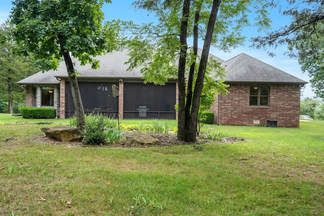 744 Seven Pines Dr, Saddlebrooke, MO 65630 - back of house with a sunroom, brick siding, a yard, a shingled roof, and crawl space