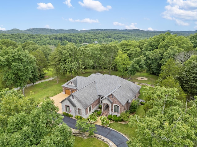 744 Seven Pines Dr, Saddlebrooke, MO 65630 - view of subject property with a forest