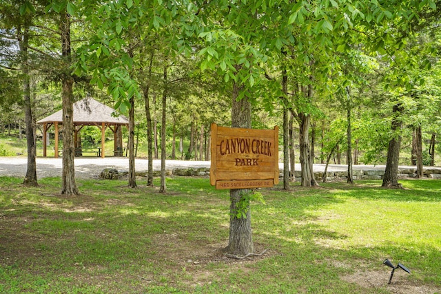 744 Seven Pines Dr, Saddlebrooke, MO 65630 - view of home's community with a gazebo and a yard