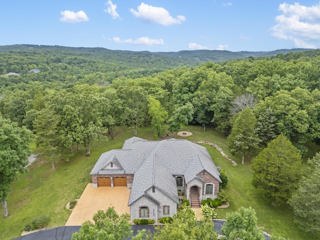 744 Seven Pines Dr, Saddlebrooke, MO 65630 - aerial view of property and surrounding area with a forest
