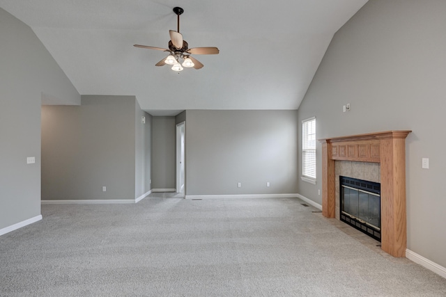 4406 W 28th St, Joplin, MO 64804 - unfurnished living room with ceiling fan, high vaulted ceiling, a tile fireplace, and light carpet