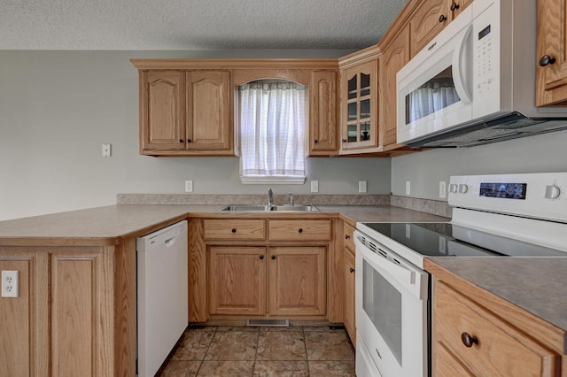 4406 W 28th St, Joplin, MO 64804 - kitchen with white appliances, a textured ceiling, glass insert cabinets, and a peninsula