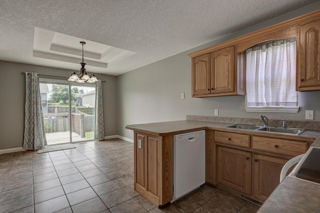 4406 W 28th St, Joplin, MO 64804 - kitchen featuring white dishwasher, a chandelier, a peninsula, a textured ceiling, and a tray ceiling