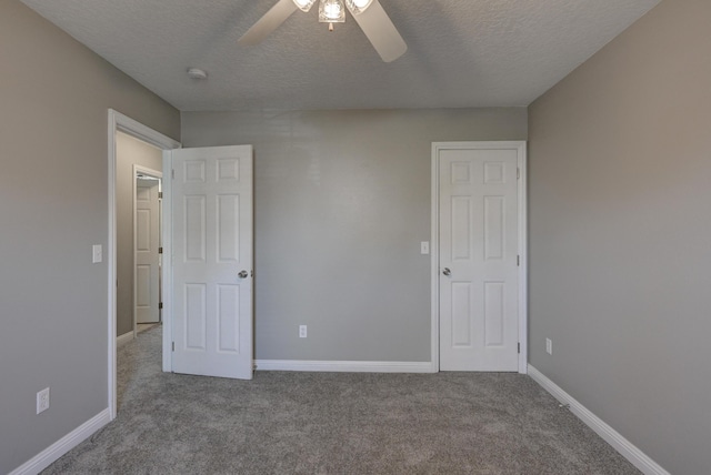 4406 W 28th St, Joplin, MO 64804 - unfurnished bedroom with a textured ceiling, carpet, and ceiling fan