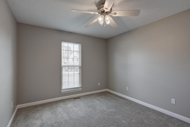 4406 W 28th St, Joplin, MO 64804 - unfurnished room with carpet flooring, a ceiling fan, and a textured ceiling
