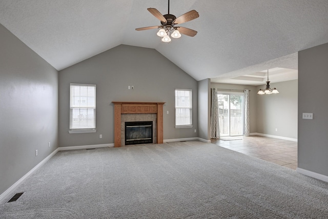 4406 W 28th St, Joplin, MO 64804 - unfurnished living room featuring light carpet, a ceiling fan, a chandelier, a tile fireplace, and vaulted ceiling