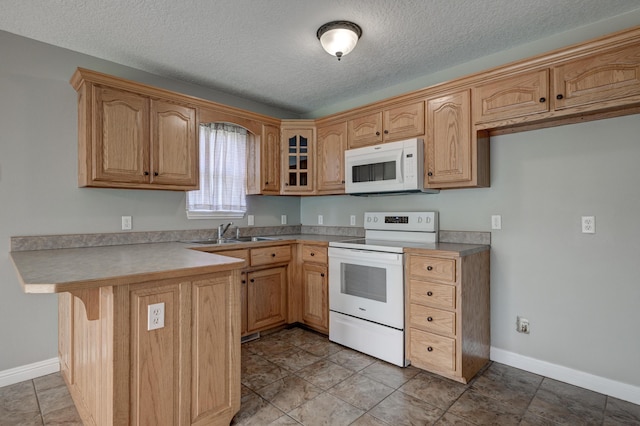 4406 W 28th St, Joplin, MO 64804 - kitchen featuring white appliances, a peninsula, glass insert cabinets, a textured ceiling, and a breakfast bar area
