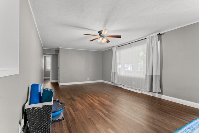 522 S Belcrest Ave, Springfield, MO 65802 - spare room featuring a ceiling fan, a textured ceiling, wood finished floors, and ornamental molding
