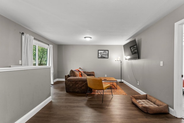 522 S Belcrest Ave, Springfield, MO 65802 - living area with baseboards and dark wood-type flooring